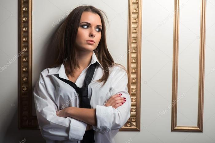 Woman wearing man's dress shirt